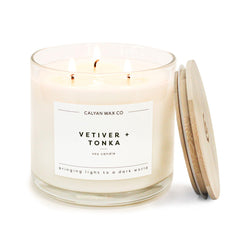 Calyan Wax Co Vetiver and Tonka 3 Wick candle in a glass jar for luxurious ambience.