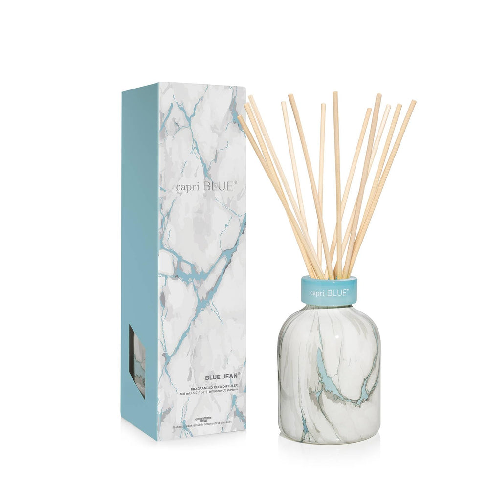 Capri Blue Blue Jean diffuser in modern marble vase enhances contemporary decor.