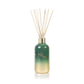 Capri Blue Glimmer Reed Diffuser bottle with crystal pine glass for elegant fragrance.