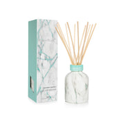 Capri Blue Modern Marble Coconut Santal diffuser bottle enhances room fragrance and decor.