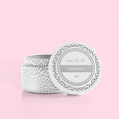 Capri Blue Volcano travel tin close-up shows white and silver design adding luxe ambience.