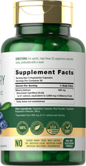 Close-up of Carlyle Bilberry Extract Capsules pouring from the bottle.