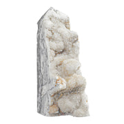 Cheungshing irregular rock crystal point on stand enhances desk decor and meditation focus.