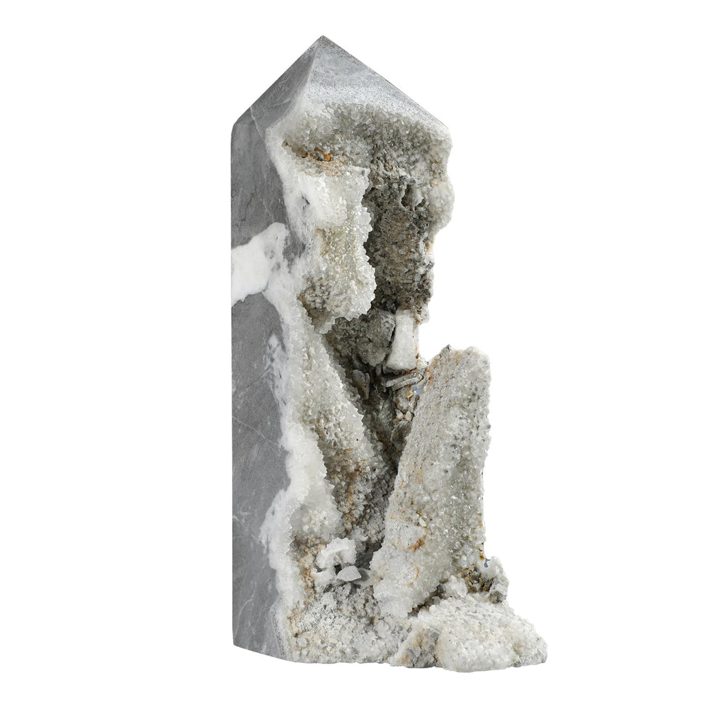 Cheungshing rock crystal point on a stand enhances desk decor with natural charm.