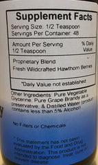 Dispensing Hawthorn Berry Heart Syrup with a dropper for easy daily use.