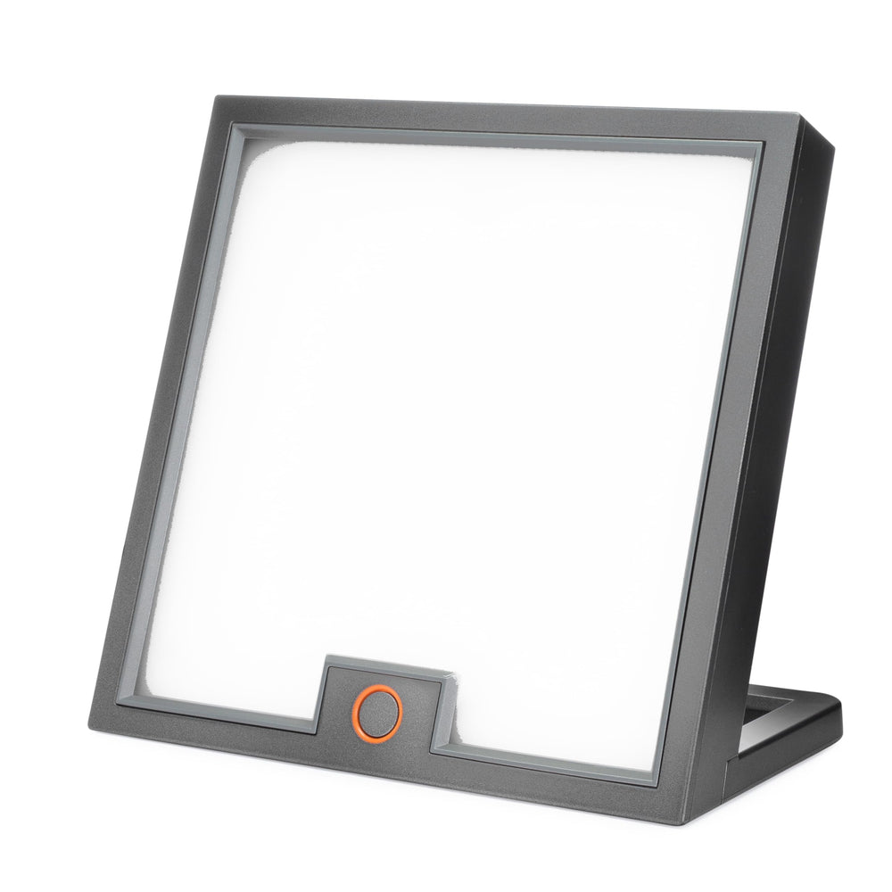 Circadian Optics Lumine desk lamp on a clean workspace for bright, mood-boosting light