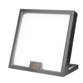 Circadian Optics Lumine desk lamp on a clean workspace for bright, mood-boosting light