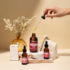 Cliganic Moringa Oil bottle on wooden surface signaling sustainable sourcing and vegan cruelty-free.