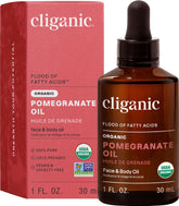 Cliganic Pomegranate Oil bottle closeup, showcasing 100% pure cold-pressed formula for nourishing skin.