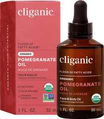 Cliganic Pomegranate Oil bottle closeup, showcasing 100% pure cold-pressed formula for nourishing skin.