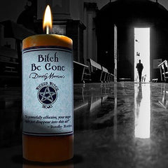 Coventry Creations Bitch Be Gone Mojo candle with herbs and orange hue boosts ritual clarity