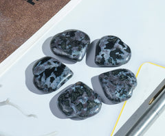 Crocon Indigo Gabbro heart stone close-up highlights polished surface for calm focus.
