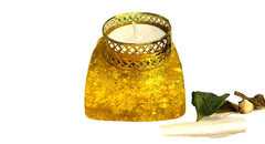 CRYSTALMIRACLE Citrine Orgonite tea light holder glows, enhancing cozy ambiance.