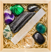 Crystalya obsidian-tumbled stone close-up for grounding and protection energy.