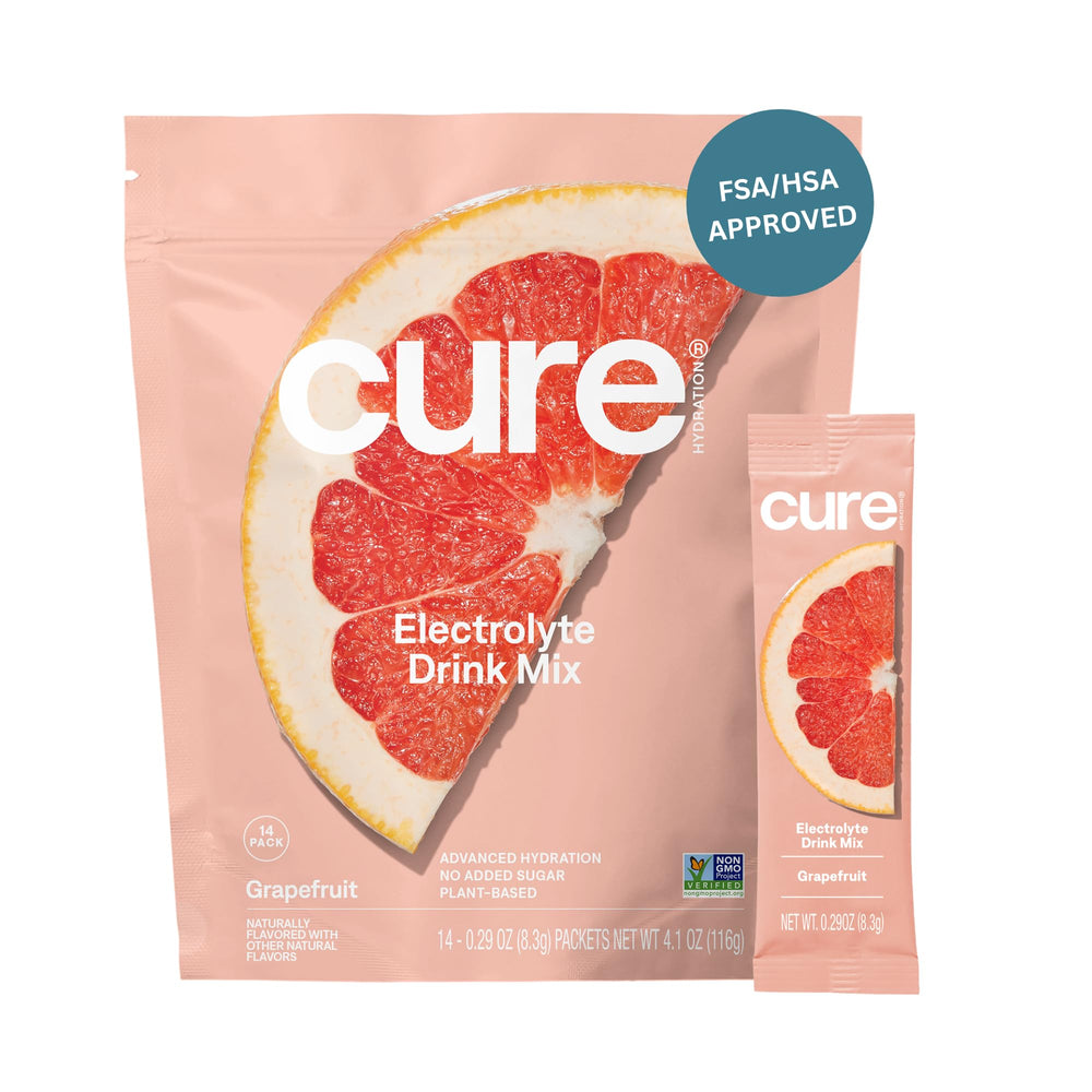 Cure Hydration grapefruit packet closeup shows convenient plant-based electrolyte mix for on-the-go hydration.