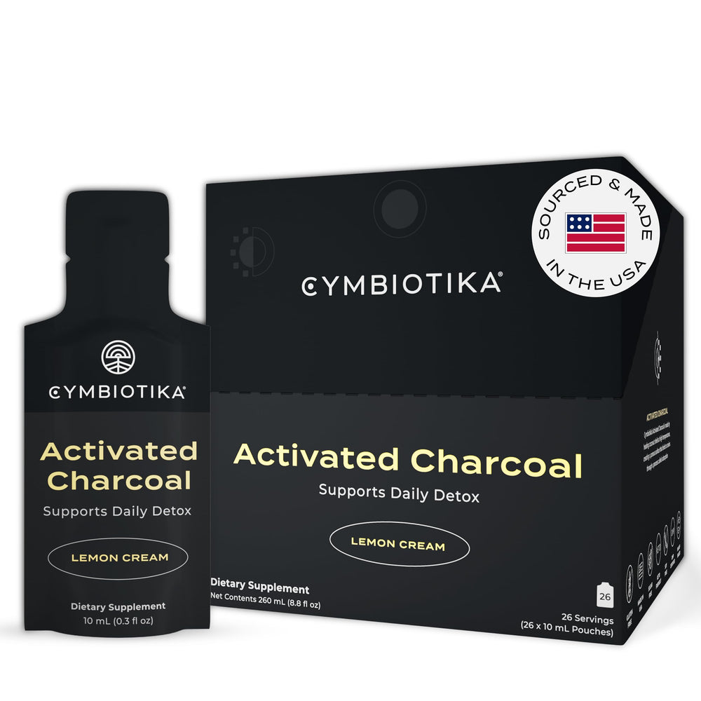 CYMBIOTIKA activated charcoal packets lemon cream bottle for quick post-meal refresh.