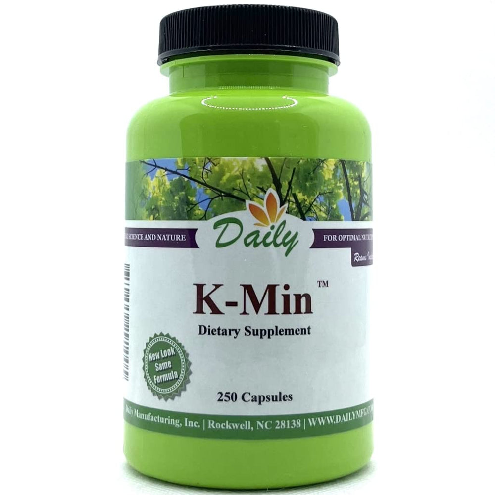 Daily Manufacturing K-Min capsule closeup, vegan calcium source for daily nutrition.