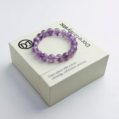 Dare to Mystic amethyst rutilated quartz bracelet close-up on wrist with clear beads
