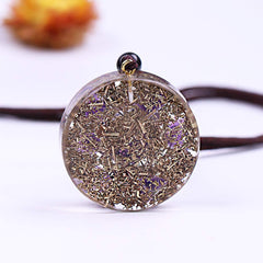 Day Day Up resin-and-metal artwork necklace with seven amethysts enhances focus.