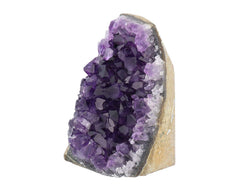 Deep Purple Project amethyst geode on display, inviting calm and color.