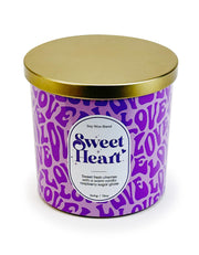 Designstyles Sweet Heart candle on a dining table creating romantic ambiance.