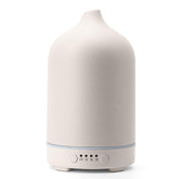 Diffuserlove ceramic diffuser with elegant cover enhances room decor and aroma.