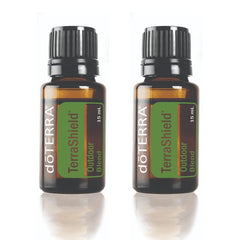 doTERRA TerraShield Outdoor Blend bottle 15ml in a sunny outdoor setting for on-the-go protection.