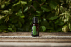 Close-up of doTERRA TerraShield Outdoor Blend cap highlighting a secure seal for travel.