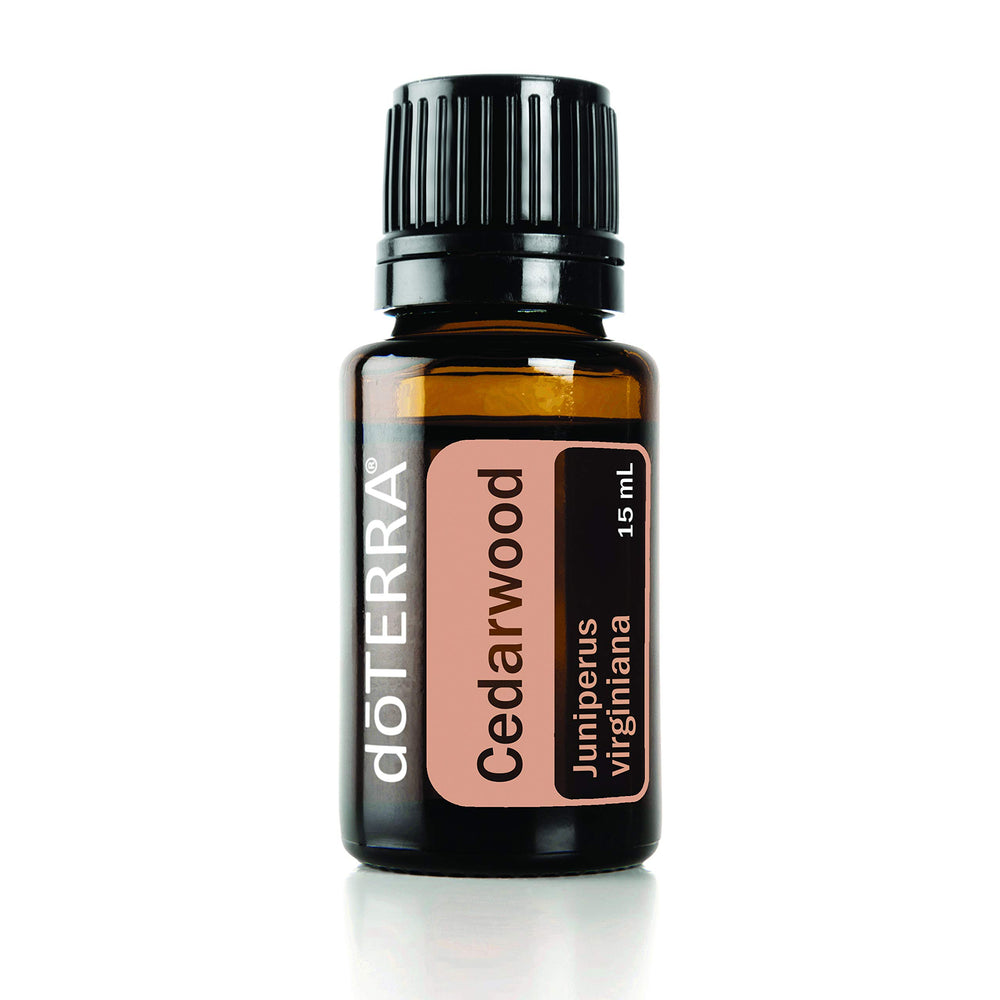 doTERRA Cedarwood essential oil bottle's warm wood aroma for relaxing ambiance.