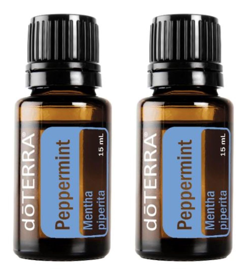 doTERRA Peppermint essential oil bottle pouring for a refreshing aroma and breathing support.