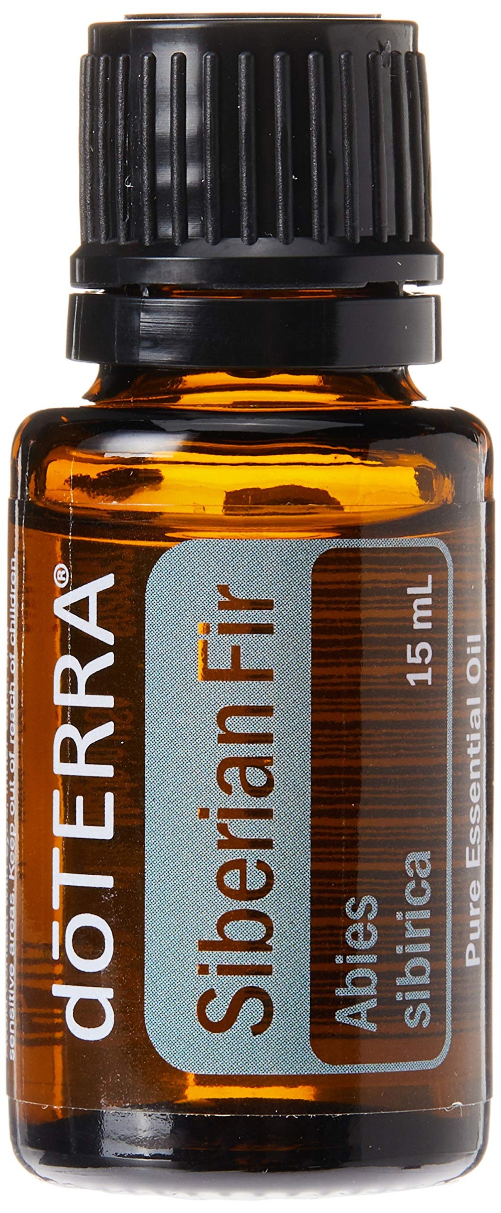 doTERRA Siberian Fir bottle pour evokes a calming, grounding scent for massage.