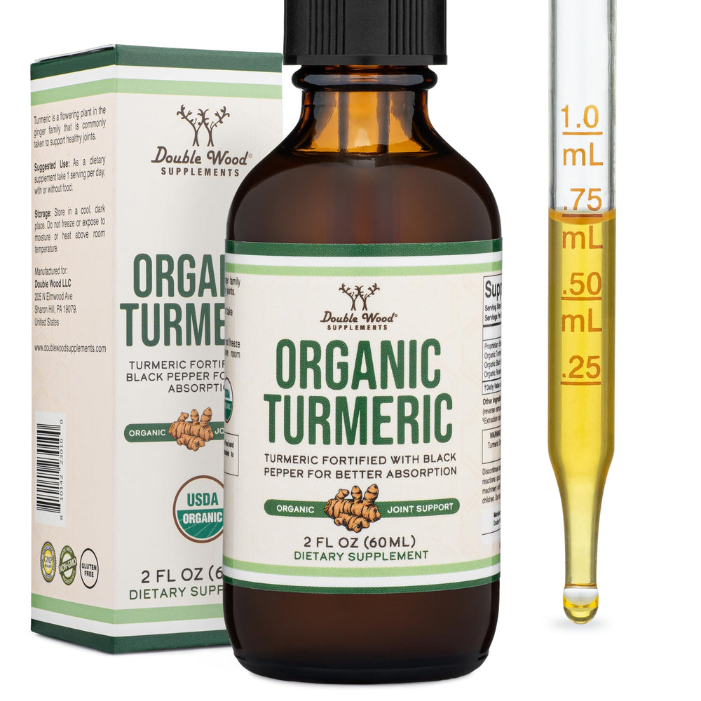 Double Wood Turmeric Drops bottle front showing organic formula for daily wellness.