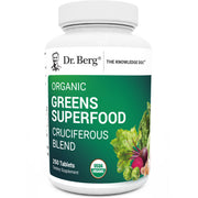 Dr. Berg's Greens tablets bottle close-up for daily vitality.