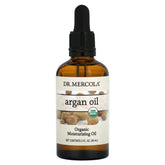Dr. Mercola Argan Oil bottle pour enhances skin and hair with a nourishing touch.