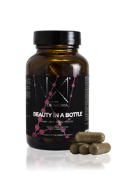 Dr. Nigma Beauty in a Bottle capsules in packaging supporting hair and nails.