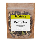 Dr. Schulze's Detox Tea bottle pour highlights the traditional herbal blend.