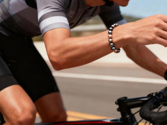 Convertible bracelet design shown, wearable on the wrist or as a slim ankle piece.