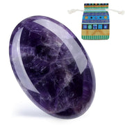 DUQGUHO amethyst palm stone in hand for calm focus during meditation.