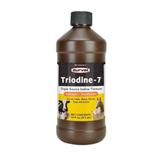 Durvet Triodine-7 bottle close-up shows iodine-based antiseptic blend for disinfection.