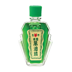 Eagle Brand natural medicated oil bottle closeup shows green formula and easy-to-use cap.