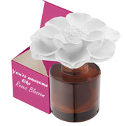 Earffloz Roses Blossom diffuser on glass top releasing concentrated aroma in a cozy room