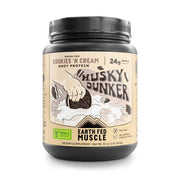 Earth Fed Muscle Husky Dunker Cookies N' Cream bottle shows grass-fed protein.