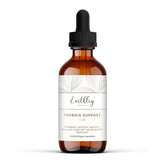 Earthley Wellness thyroid tincture bottle on countertop for daily drops aiding balance