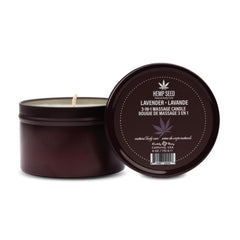 Earthly Body 3-in-1 Massage Candle lavender lit for warm massage and ambient fragrance.