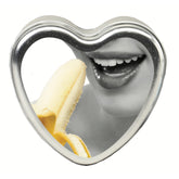 Earthly Body banana heart-shaped edible massage candle ready to melt into nourishing oil