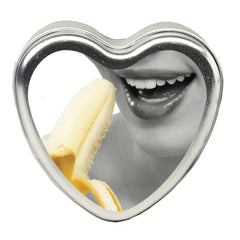 Earthly Body banana heart-shaped edible massage candle ready to melt into nourishing oil