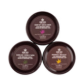 Earthly Body Three Candle Pack lit candles create a cozy spa ambiance.