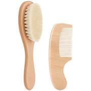 Eclatbox baby hair brush with natural wood and goat bristles for gentle scalp care.