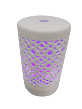 EcoGecko ceramic essential oil diffuser emitting fine mist for calming home ambiance.