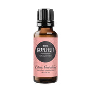 Edens Garden Grapefruit Pink essential oil bottle close-up with label for purity.